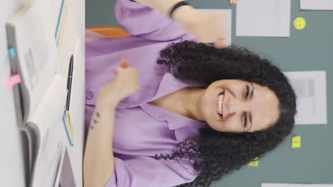 Vertical-video-of-Female-student-experiencing-joy-looking-at-camera.